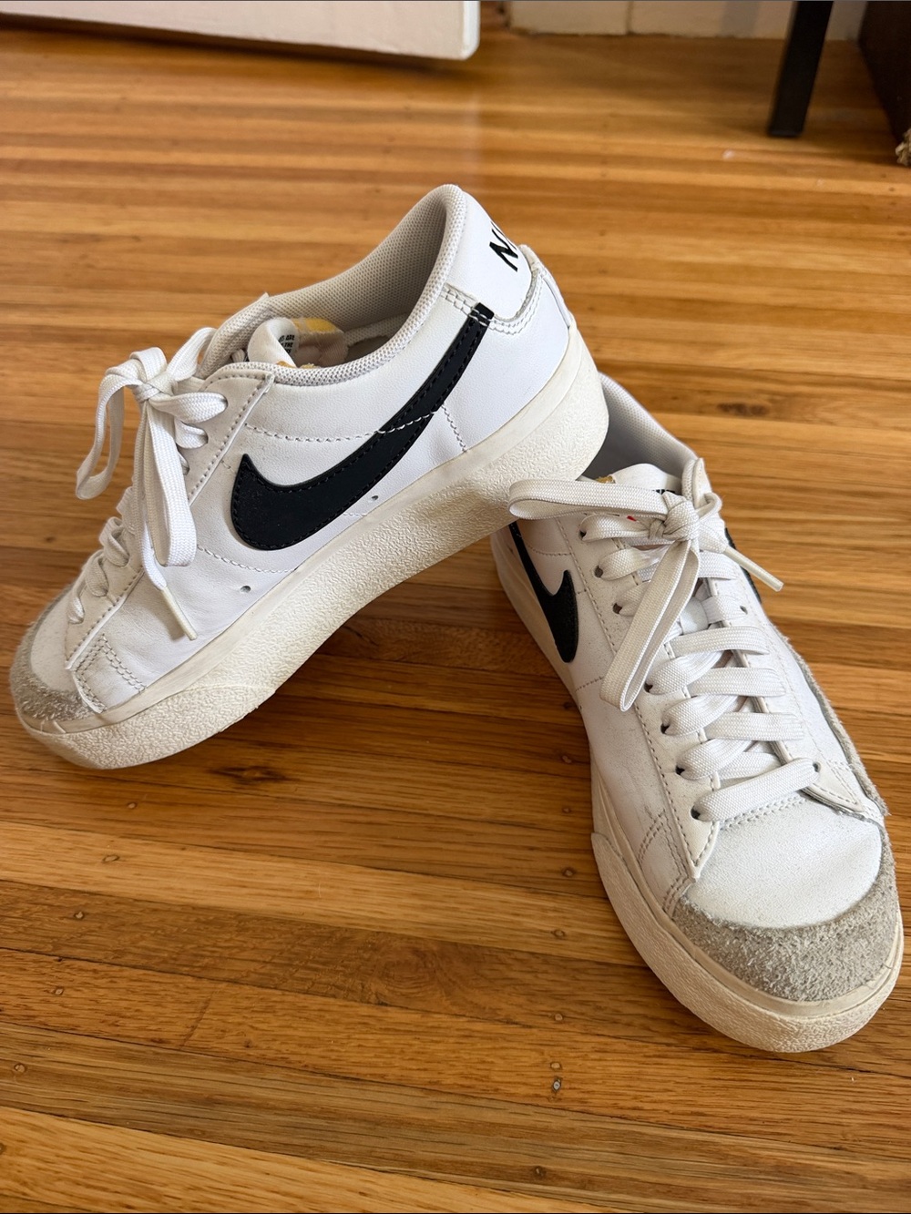 Nike White Sneakers with Black Swoosh and Gray Toe Accents